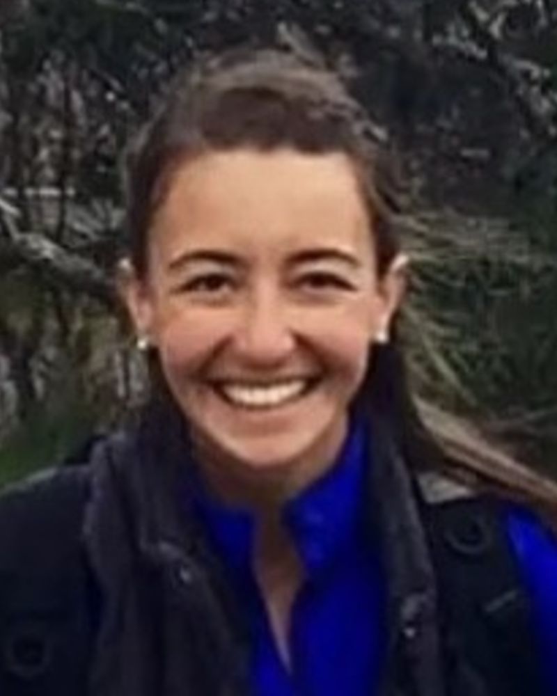 Callie Selin hugging a yellow lab